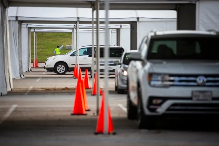 Cars lined up to vote in the drive-thru line at NRG Stadium in Houston during the first day of early voting on Oct. 13, 2020. The judge's ruling follows two related decisions by the Texas Supreme Court rejecting efforts to have Harris County's drive-thru voting process deemed illegal. It appears to clear the way for all drive-thru votes to be counted on Election Day tomorrow.